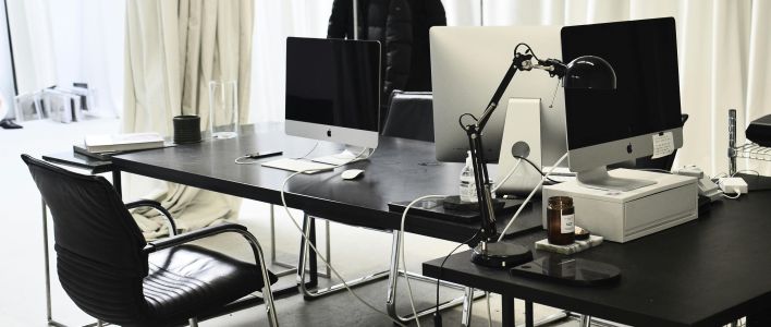 Workspace with modern convenient computers in daytime